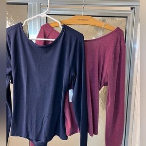 Two long sleeved Gap Fit open backed twist shirts in medium tall.